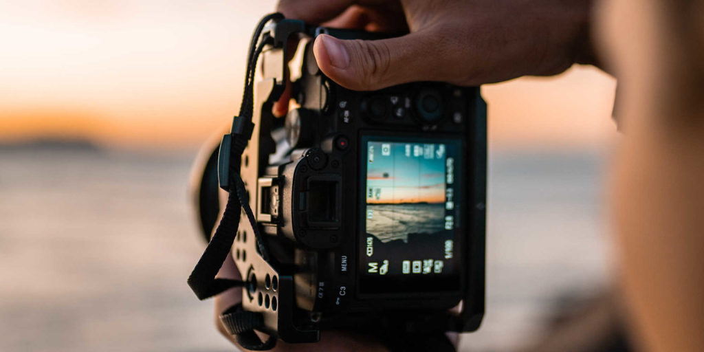 Photographer photographing ocean